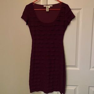Purple form fitting cocktail dress with ruffles